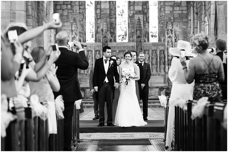 bride and groom leaving brewed church