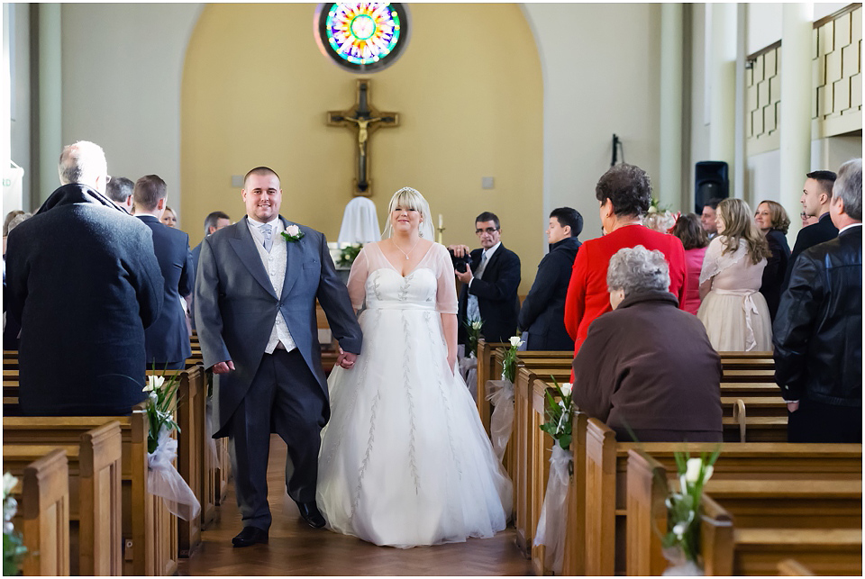 bride and groom leaving wedding ceremony