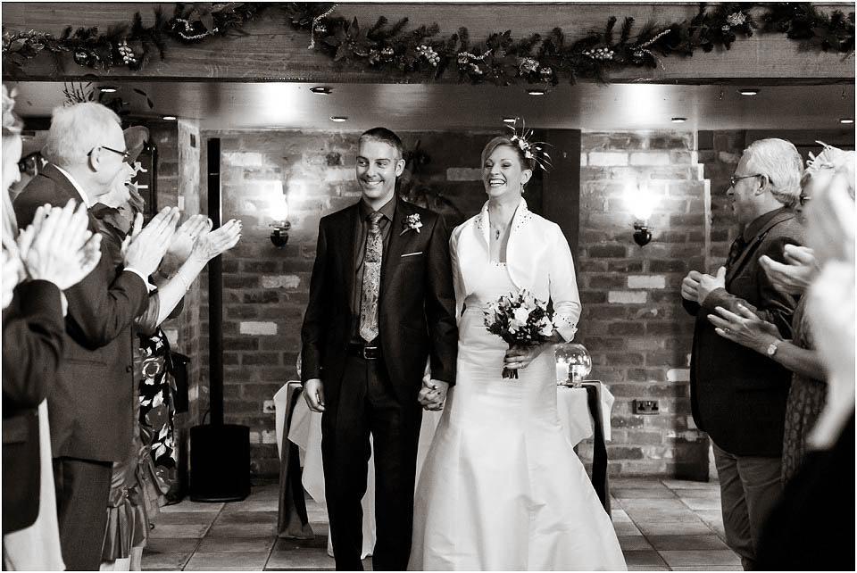 bride and groom walking down isle