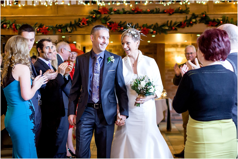 bride and groom lauhing