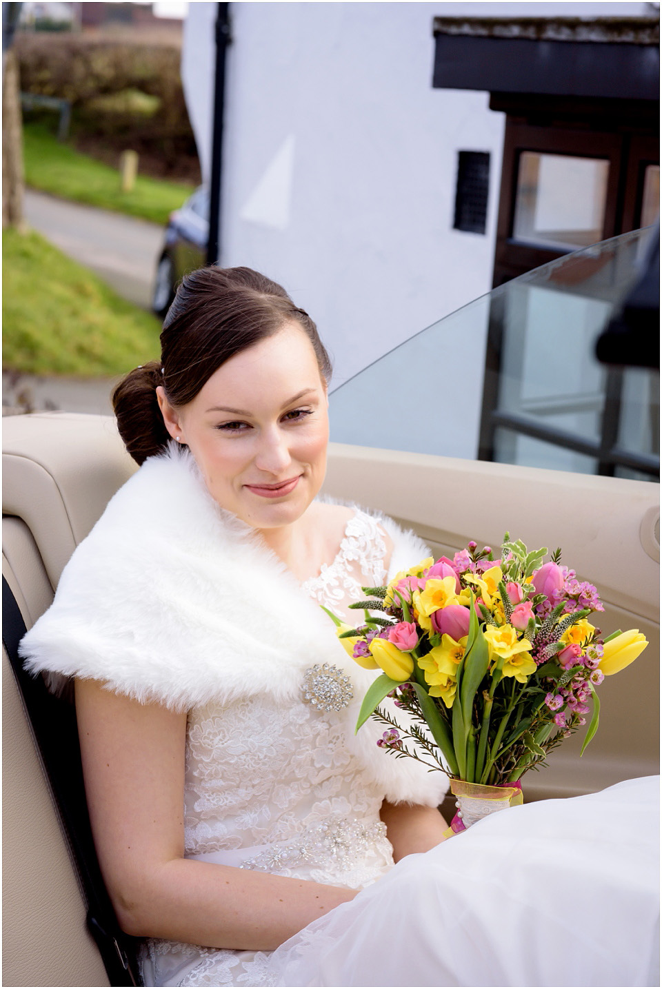 bride with spring wedding bouquet