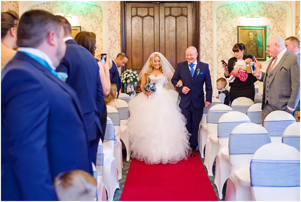 bride walking down isle at rowton castle