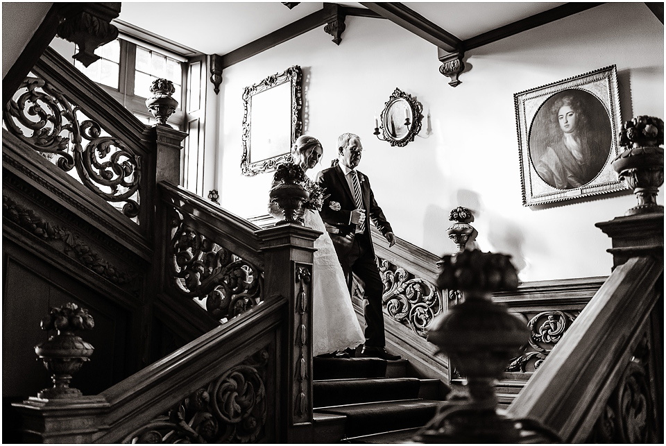 bride and father walking down stairs at thrumpton hall