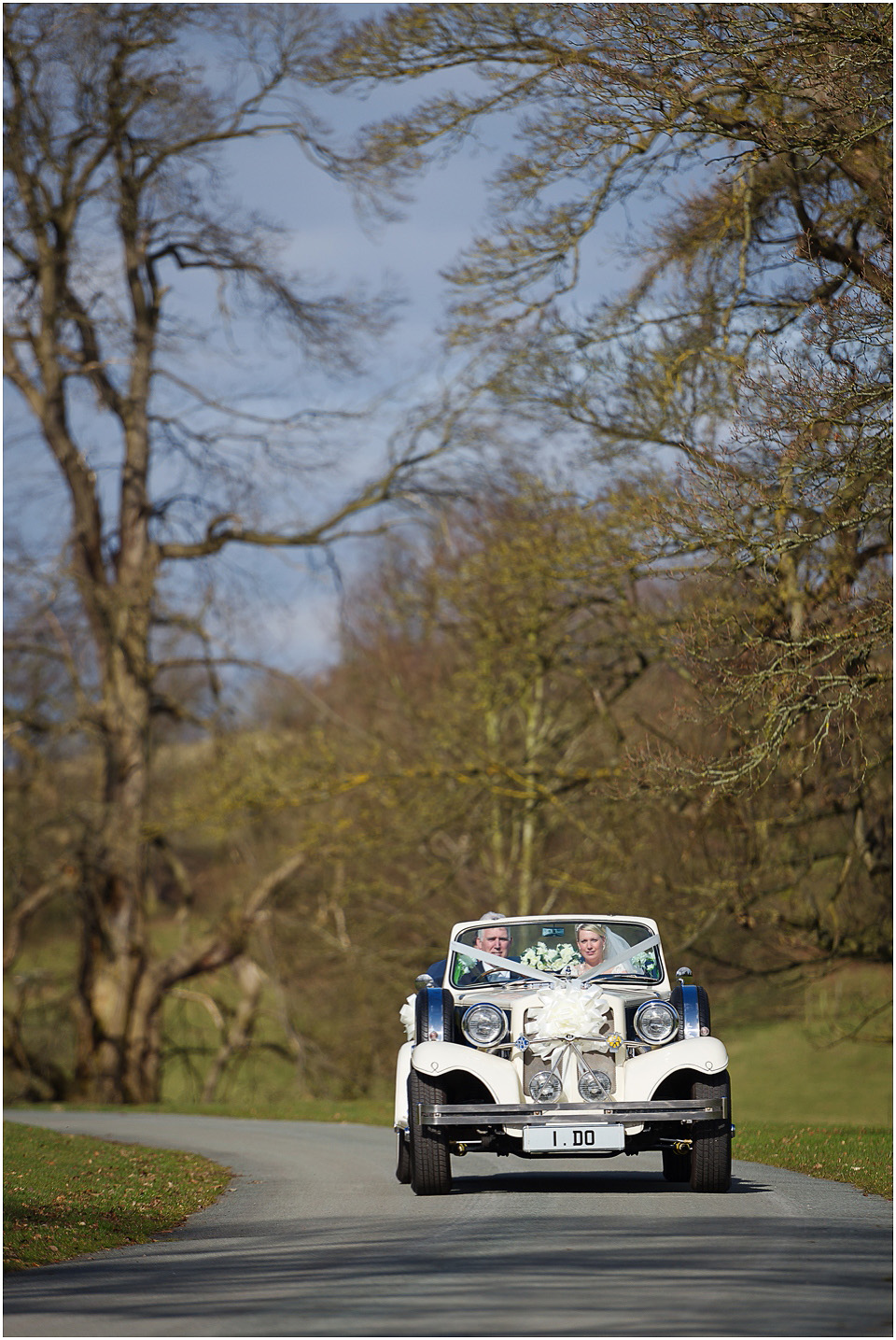 arriving at sandon hall venue in wedding car
