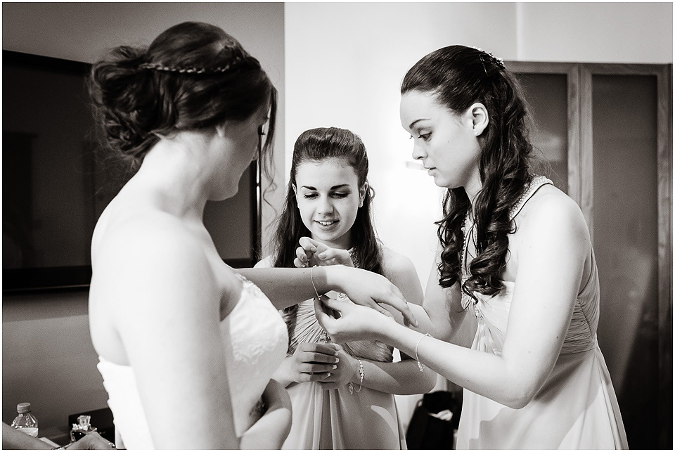 bridesmaids helping brode