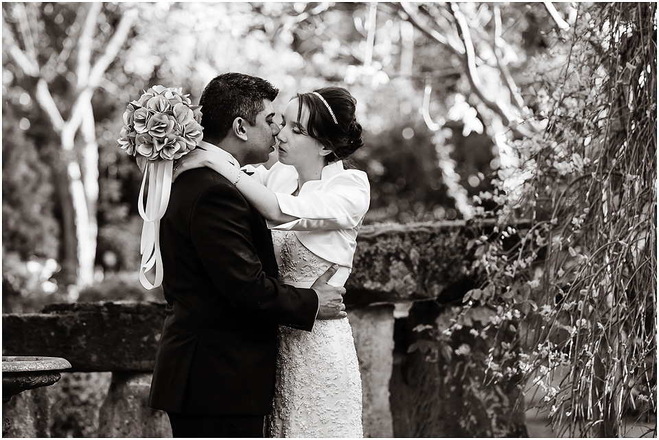 bride and groom kiss at hundred house