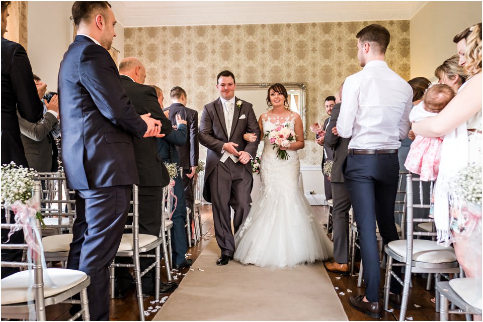 bride and groom leaving wedding ceremony