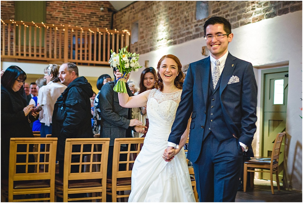 bride and groom leave wedding
