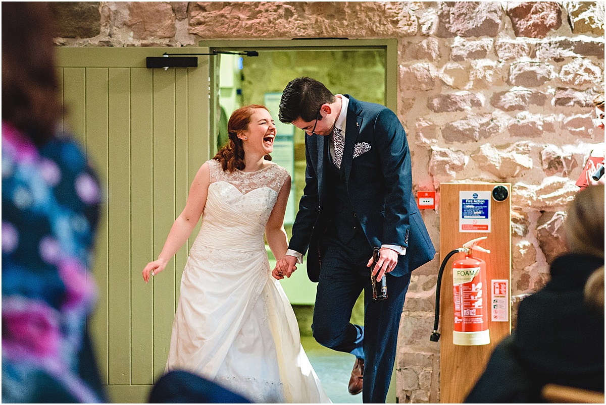 bride and groom entering wedding breakfast