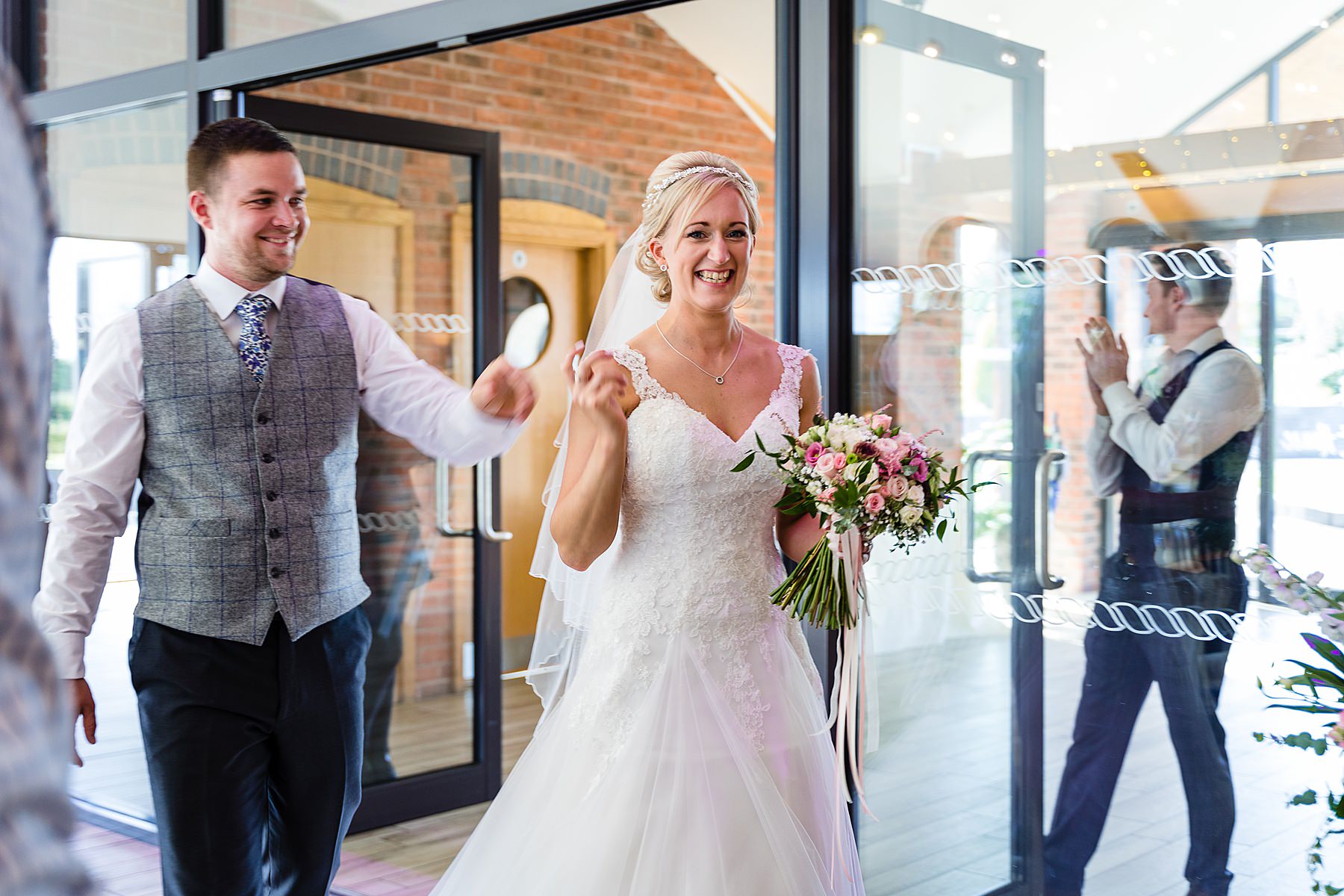 bride and groom enter room