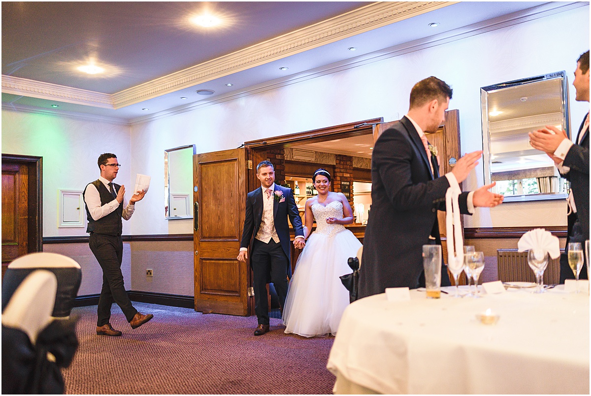 brode and groom enter room