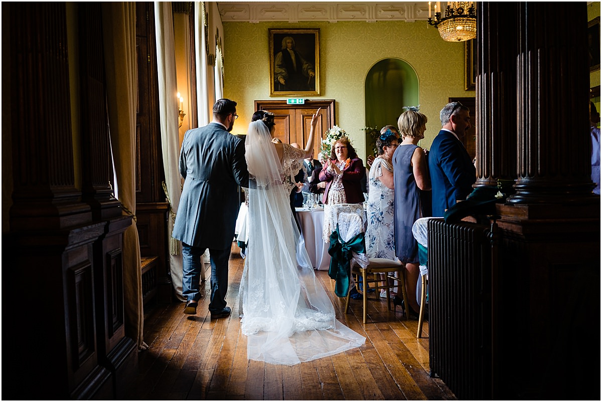 bride and groom enter dining room