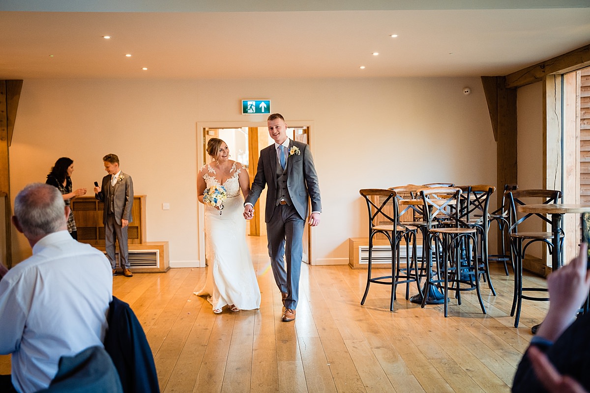 bride and groom enter room