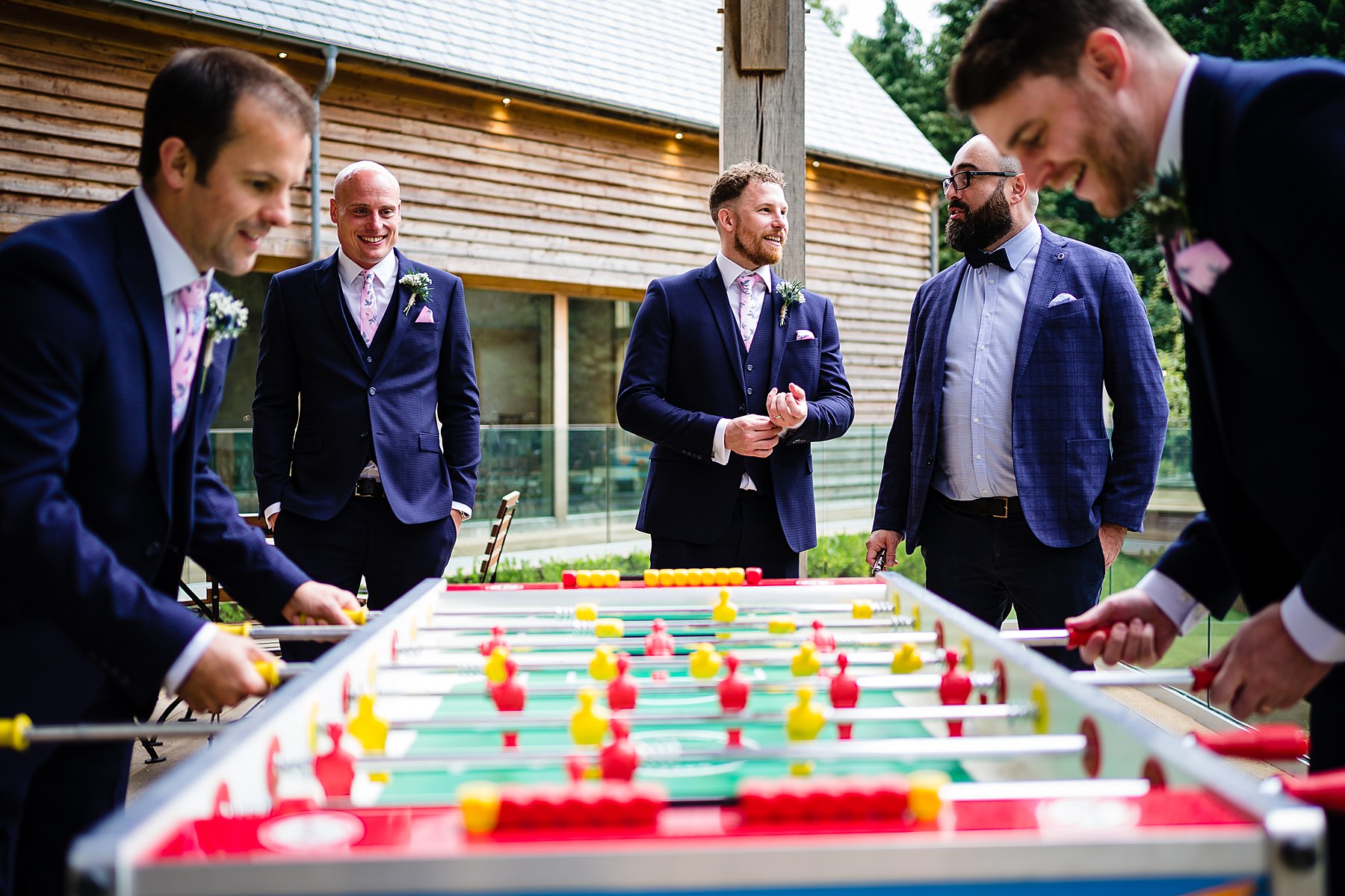 groom playing table football