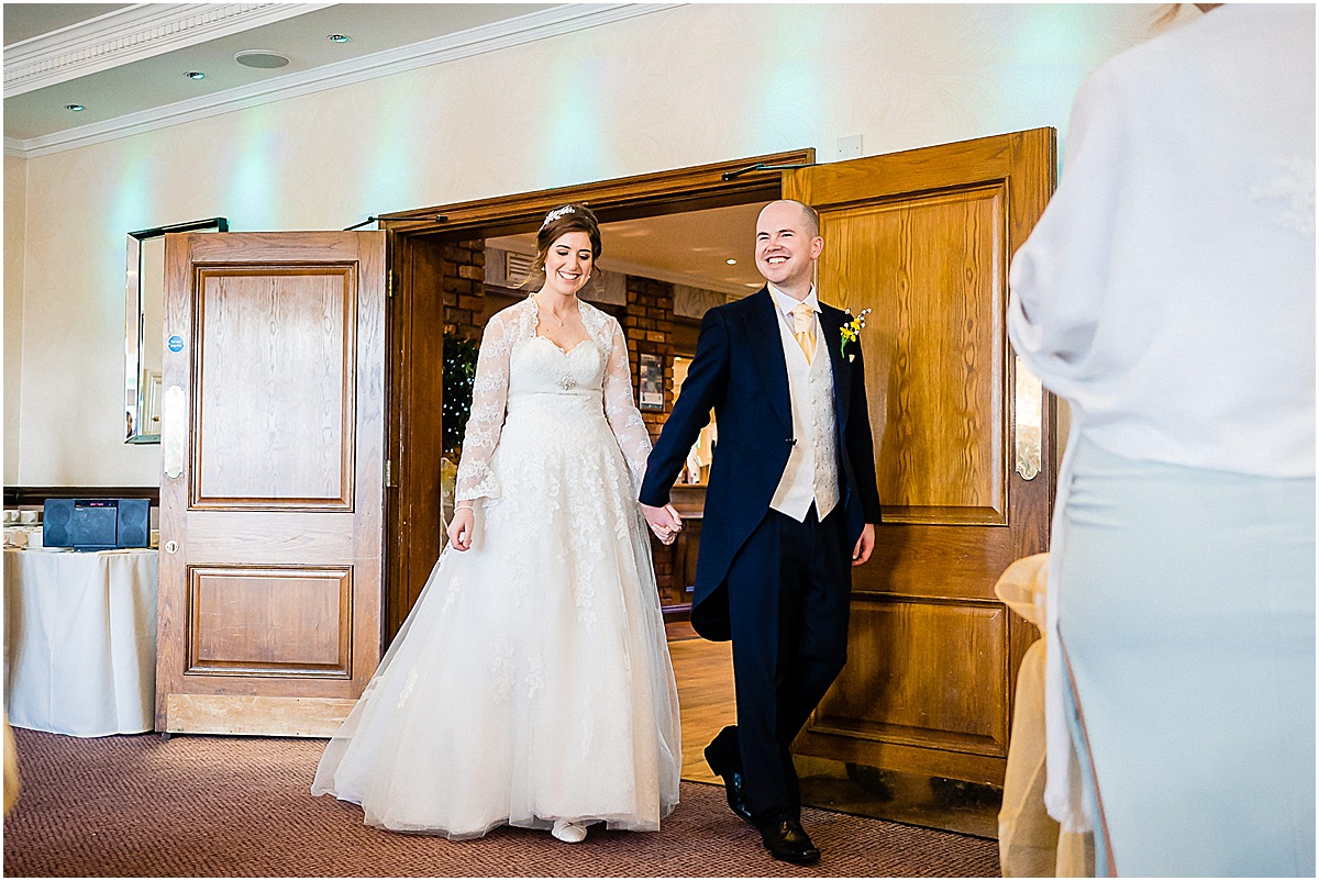bride and groom enter room
