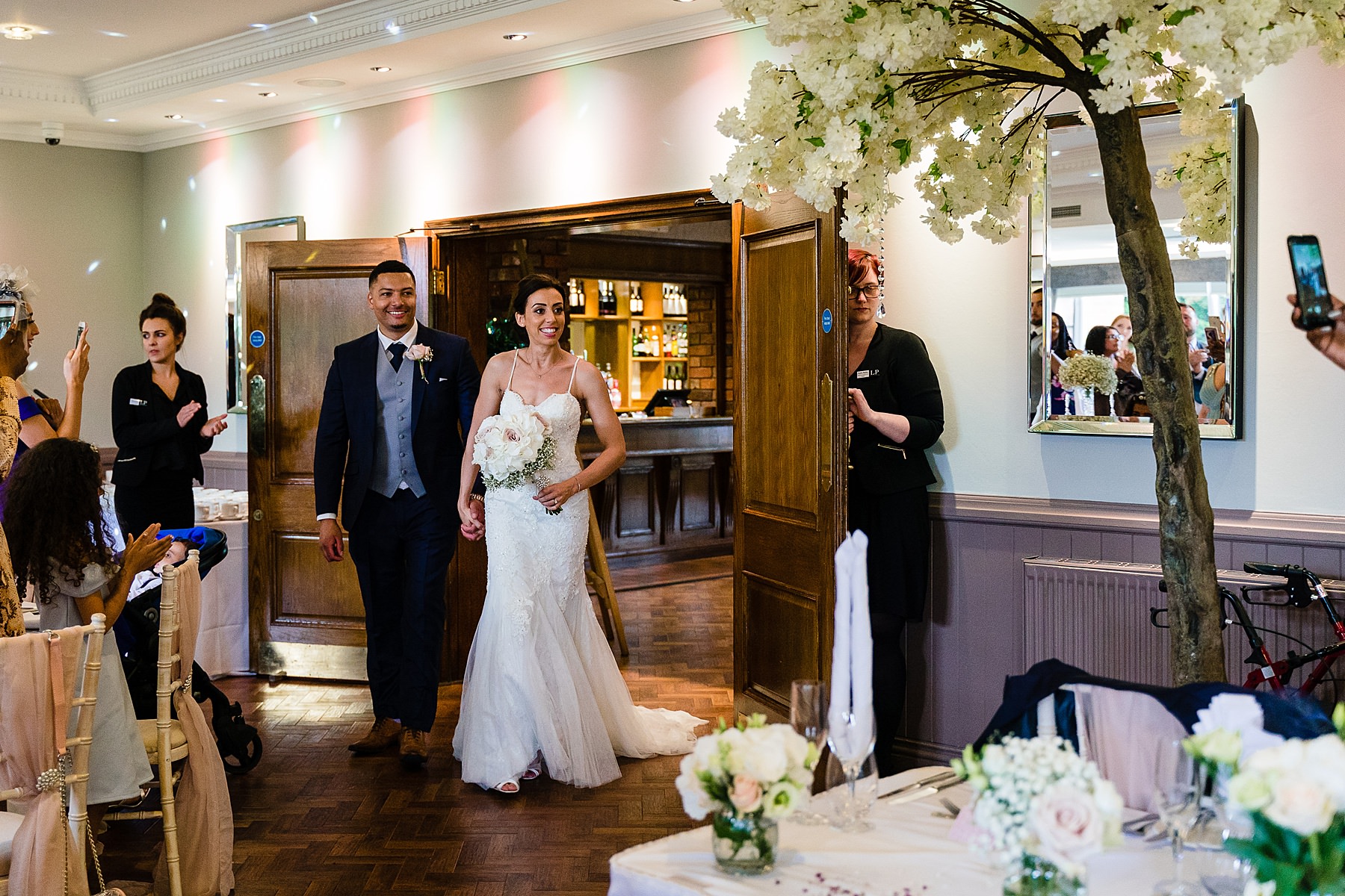 bride and groom enter ceremony room