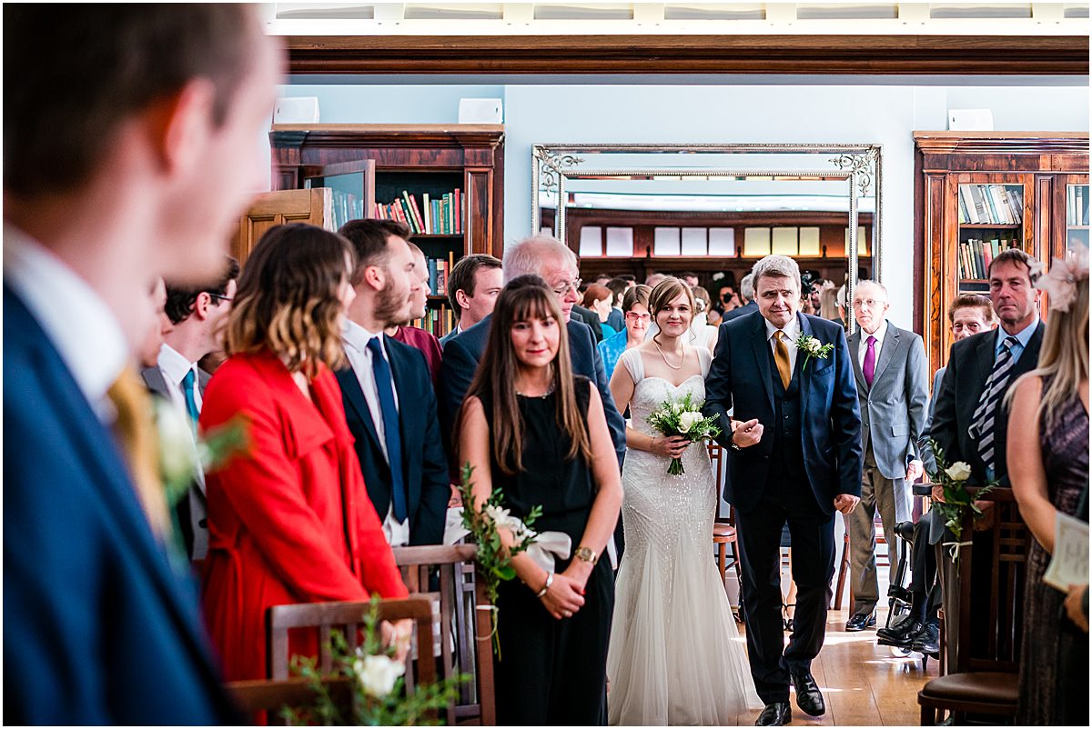 bride and dad walking down isle