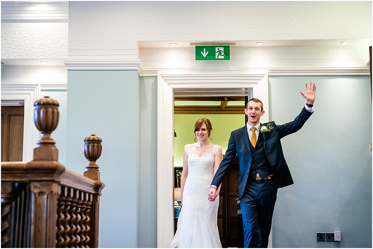 bride and groom enter dining room