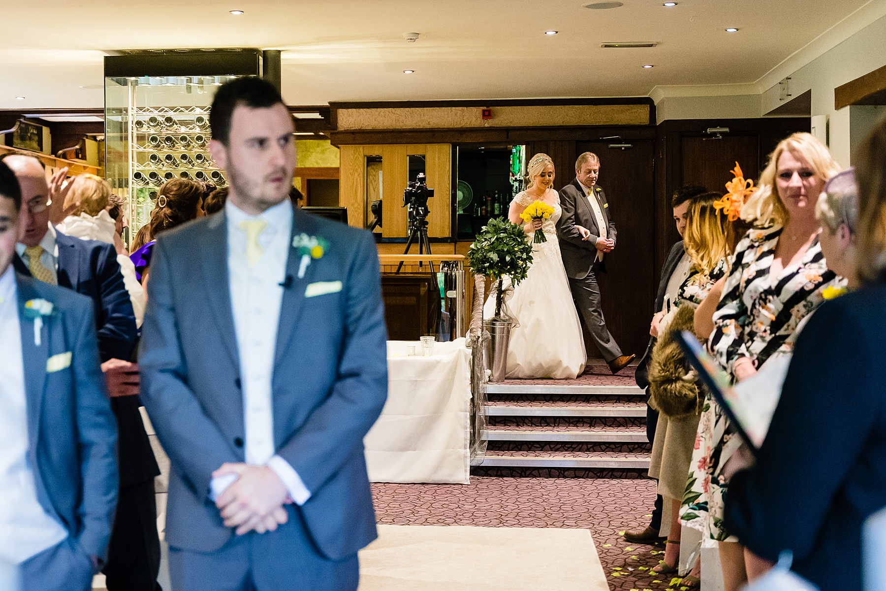 bride walks down isle