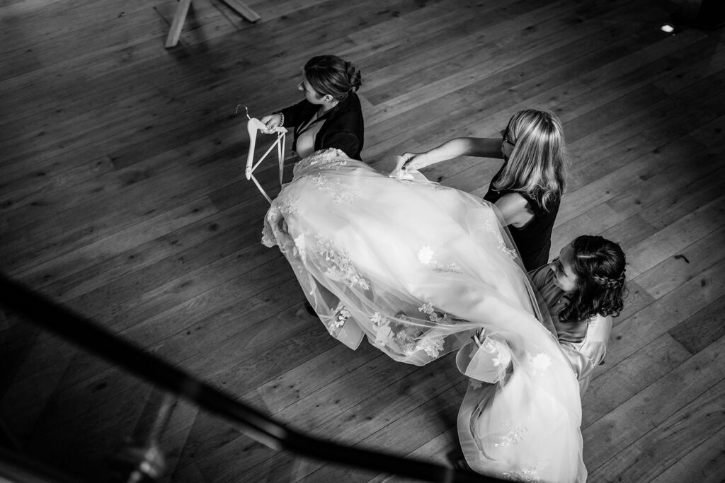 bridesmaids arriving with dress