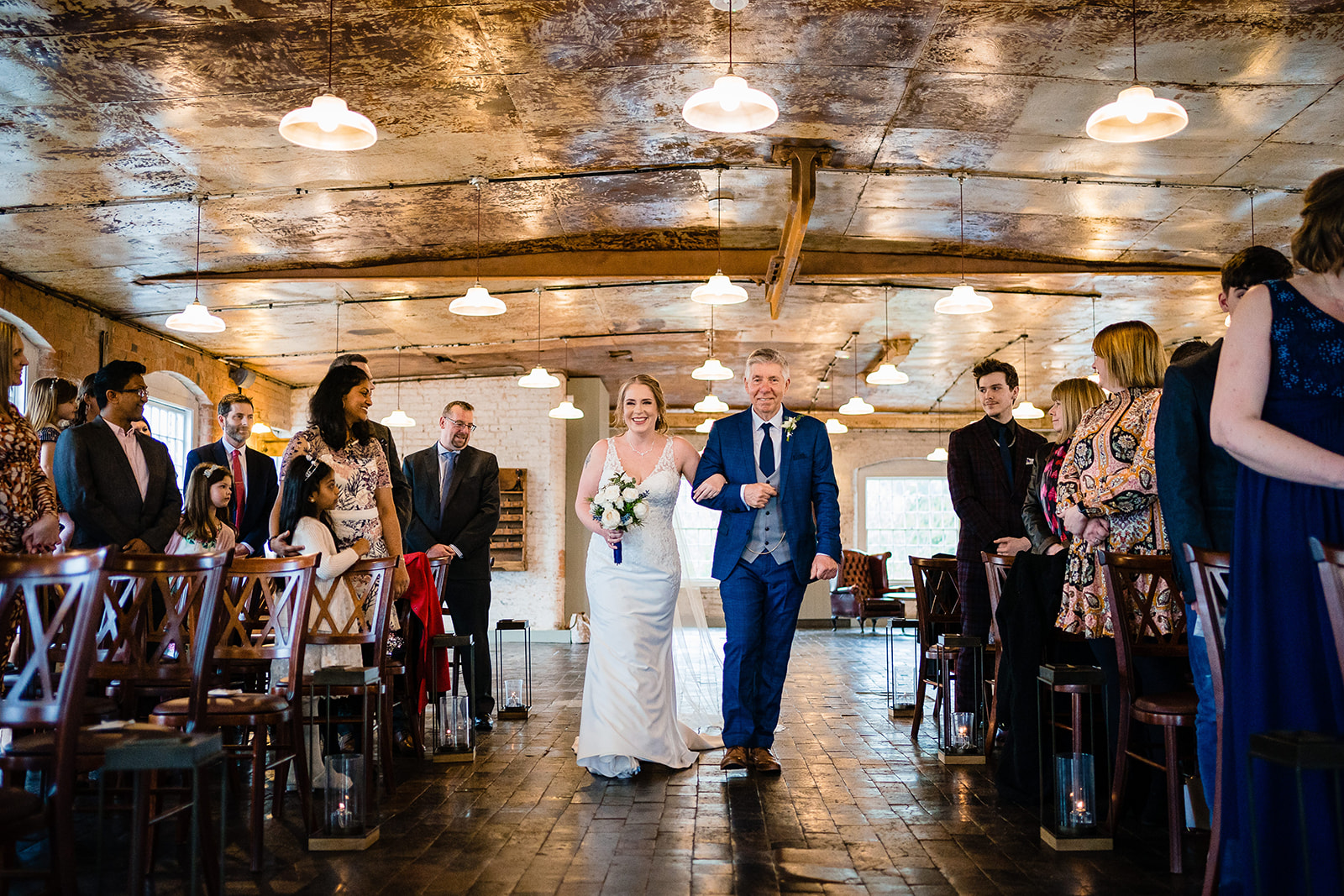 bride and dad walking down aisle
