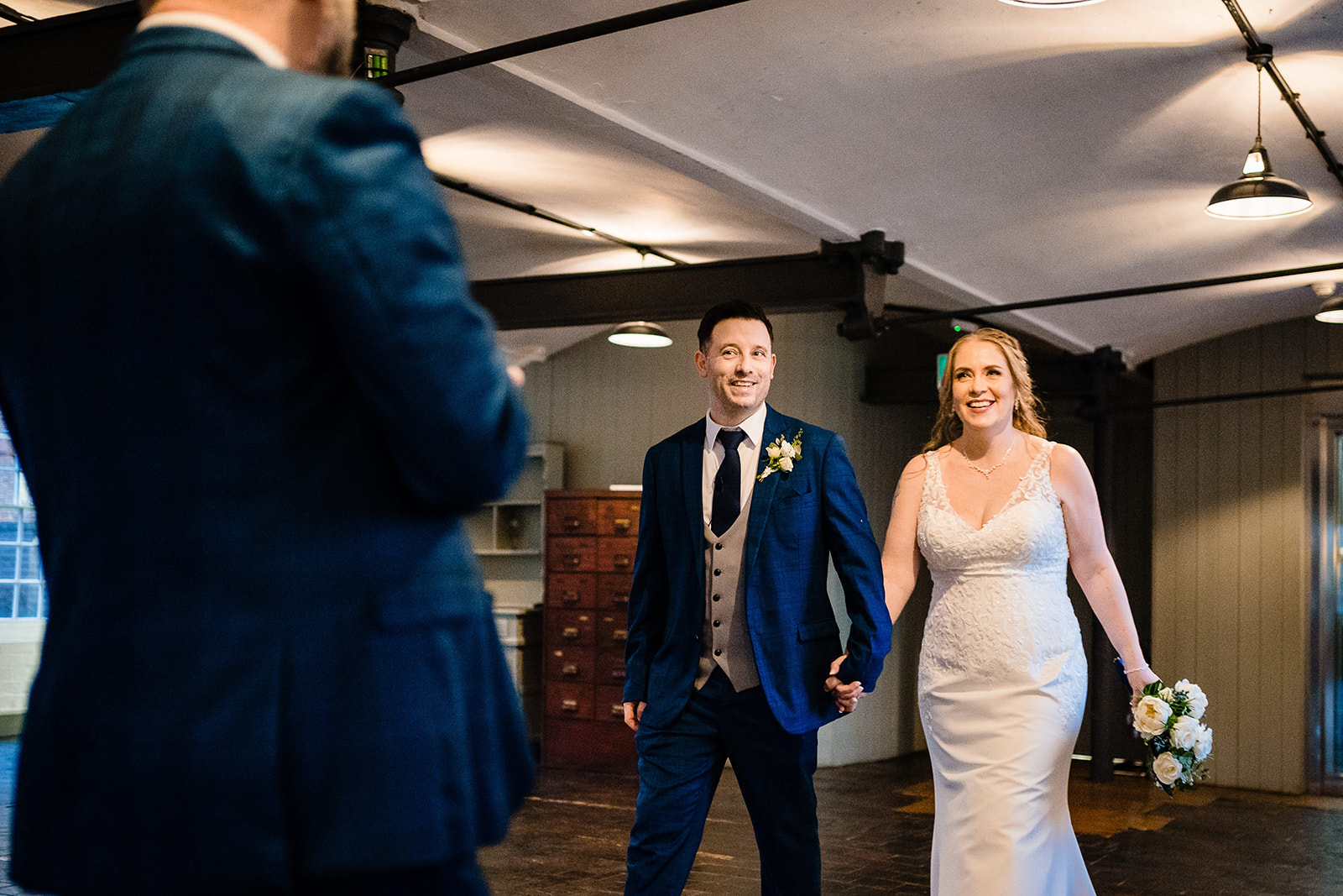 bride and groom enter room