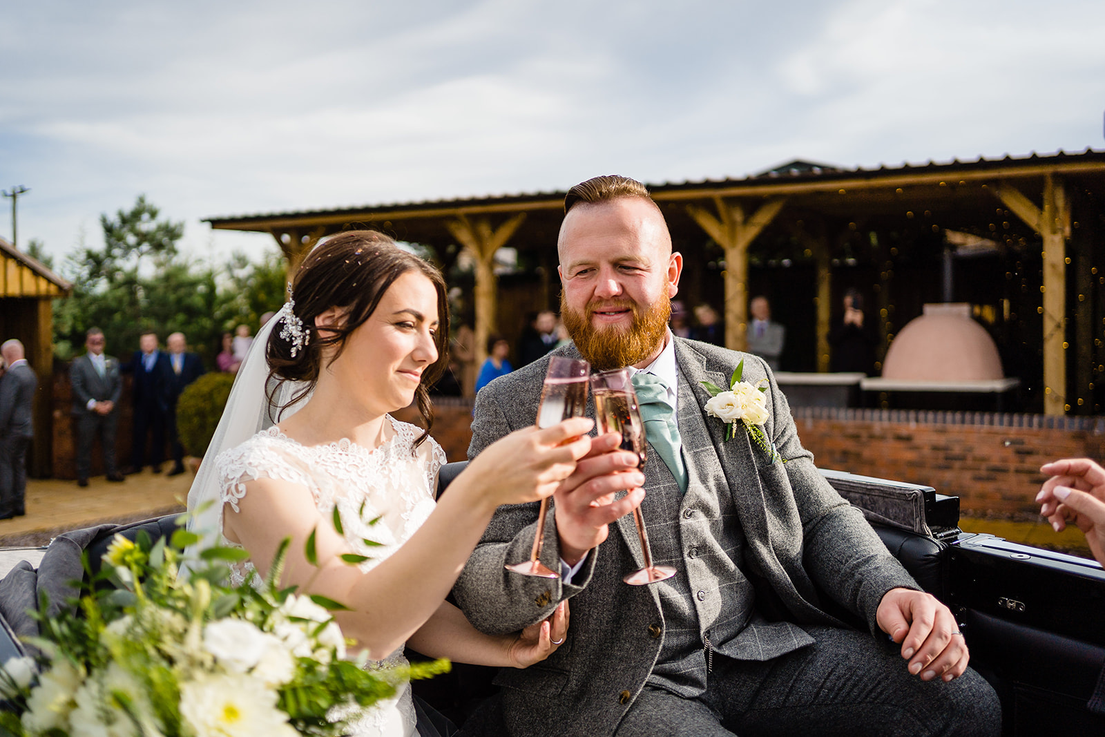 bride and groom on horse drawn cart